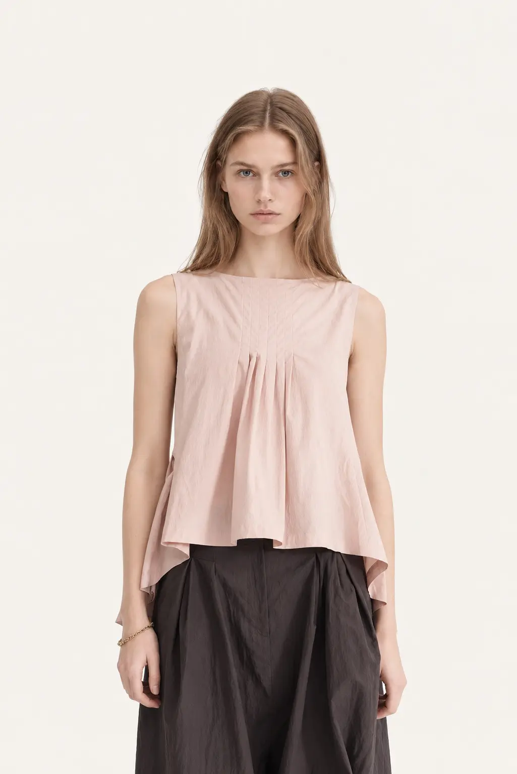 [CAHISIENNE] Pintuck Detail Asymmetric Hem Blouse (Baby Pink)